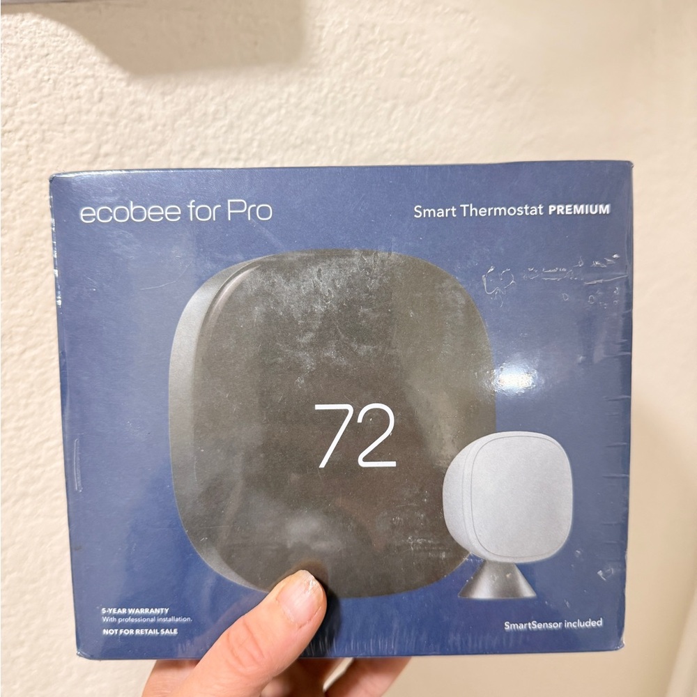 Gray and Blue Smart Thermostat with Minimalist Design
